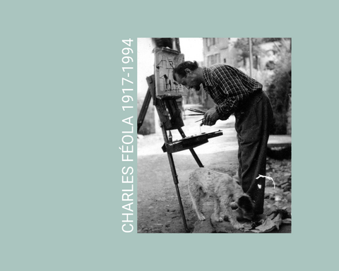 Photo de Charles Féola peignant une toile sur un chevalet en compagnie de son chien